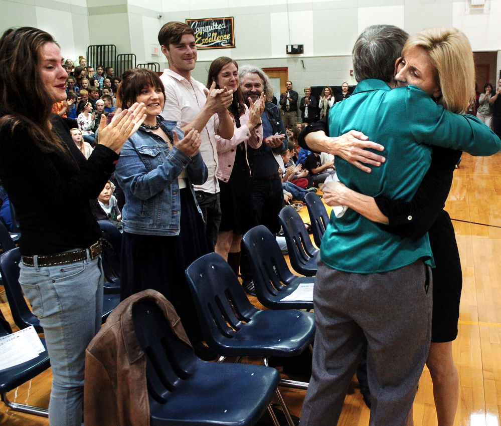 Skowhegan Area Middle School teacher Tammy Ranger, right, is hugged by her mother, Marlene Everett, after being selected as the 2017 Maine Teacher of the Year.