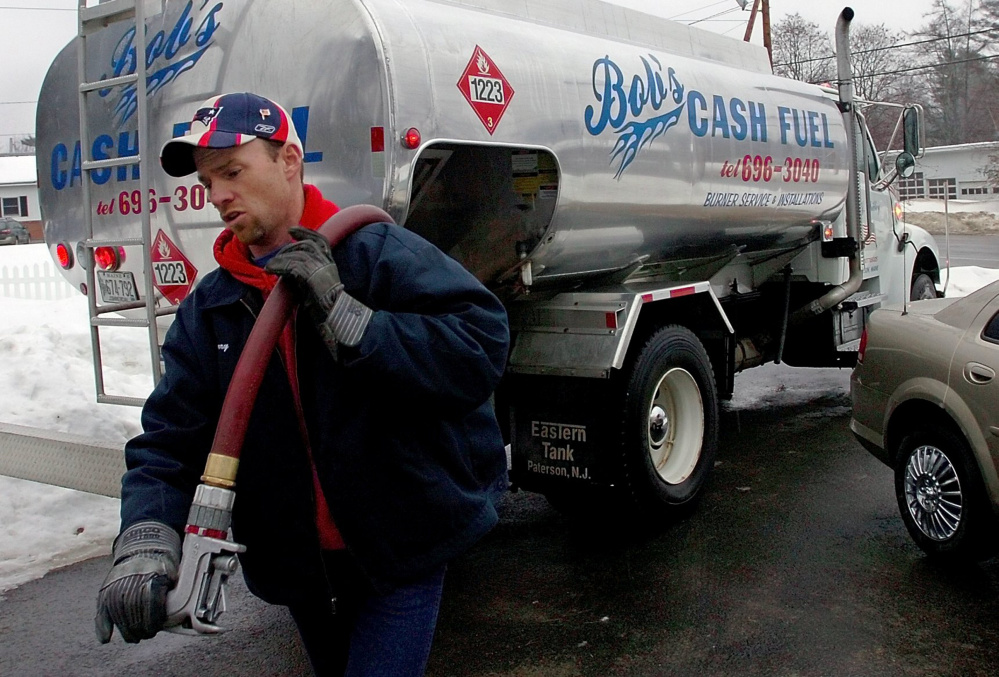 Jerry Prescott of Bob's Cash Fuel in Madison prepares to fill a tank with heating oil last winter.