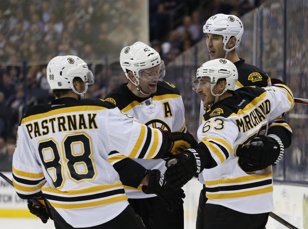 Brad Marchand, front right, celebrates his goal against Columbus with David Pastrnak, David Backes and Zdeno Chara in the third period Thursday night.