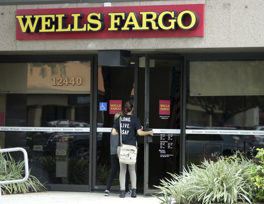 Wells Fargo says bank visits are down and consumer checking account openings dropped 25 percent in September from a year earlier and they were down 30 percent from August.