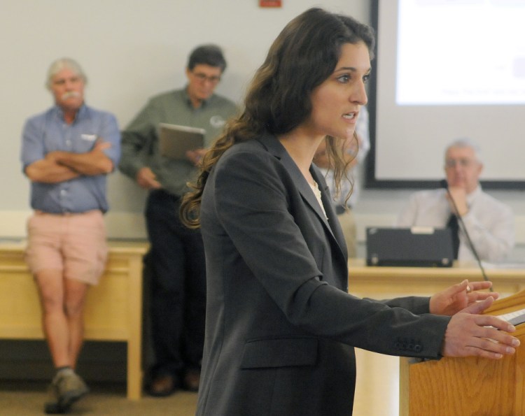 Conservation Law Foundation attorney Emily Green makes a point about proposed rule changes for small-scale solar panels during a hearing Monday at the Maine Public Utilities Commission in Hallowell.