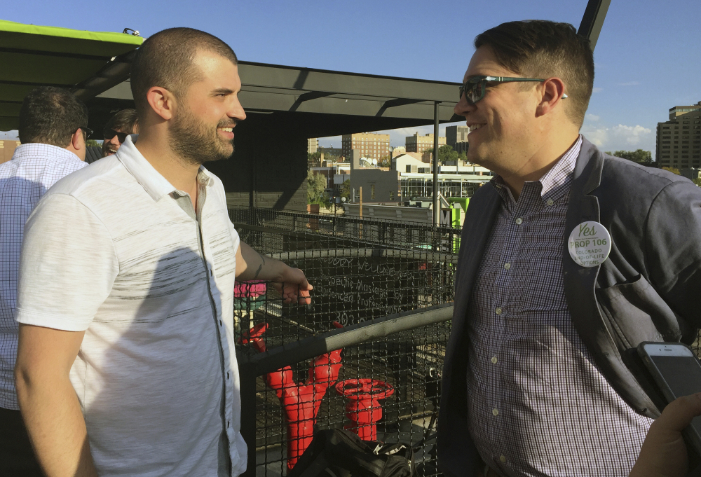 Denver marijuana consultant Kayvan Khalatbhari, left, chats with a lobbyist Joe Megysy at a fundraiser for marijuana policy reform in Denver. Drawn by the possibility of profits, a donor base of entrepreneurs is willing to spend money to change drug policy.