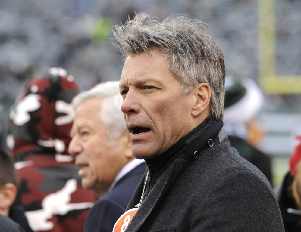 Jon Bon Jovi looks on as the New York Jets and New England Patriots warm up before an NFL game in 2014 in East Rutherford, N.J.