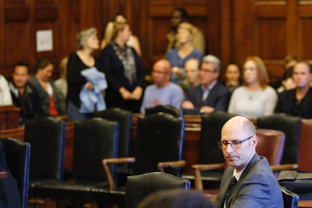 Landlord Gregory Nisbet sits in the courtroom Friday as family members of the victims of the Noyes Street fire react to the not guilty verdicts from Justice Thomas Warren.