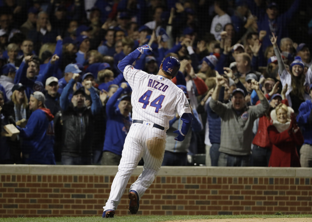 Chicago's Anthony Rizzo celebrates his home run during the fifth inning of Game 6 of the NLCS against the Los Angeles Dodgers on Saturday. The Cubs won, 5-0, to advance to the World Series against the Cleveland Indians.