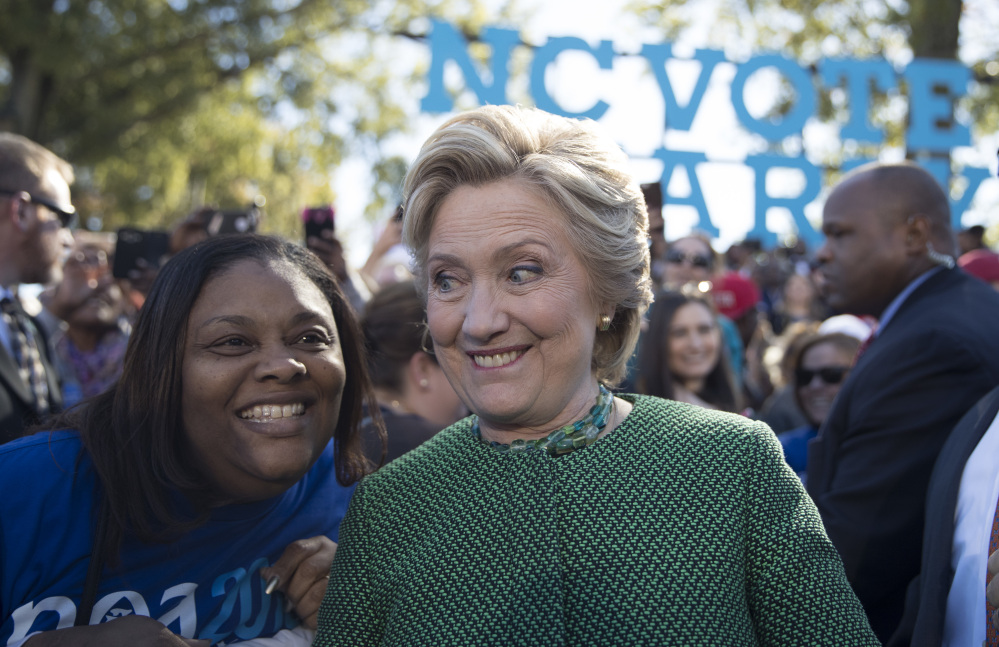 Democratic presidential candidate Hillary Clinton greets supporters during a campaign event at St. Augustine’s University on Sunday in Raleigh, N.C. Clinton’s strong poll numbers are allowing her to buoy downballot Democratic campaigns.
Associated Press/Mary Altaffe