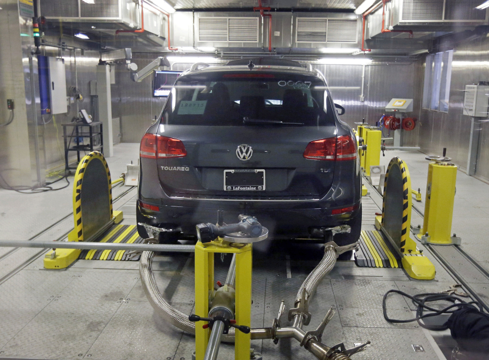 A Volkswagen Touareg with a diesel engine undergoes an emissions test in Michigan. This week's ruling by a federal judge represents the biggest auto-scandal settlement in U.S. history.