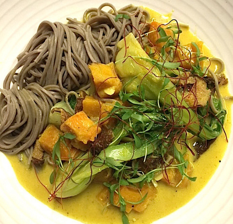 The squash and house yellow curry is the first vegan dinner entree on the menu at Union in the Press Hotel in Portland.