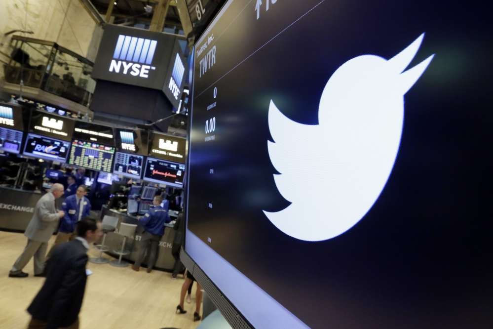 The Twitter symbol appears above a trading post on the floor of the New York Stock Exchange in July.
