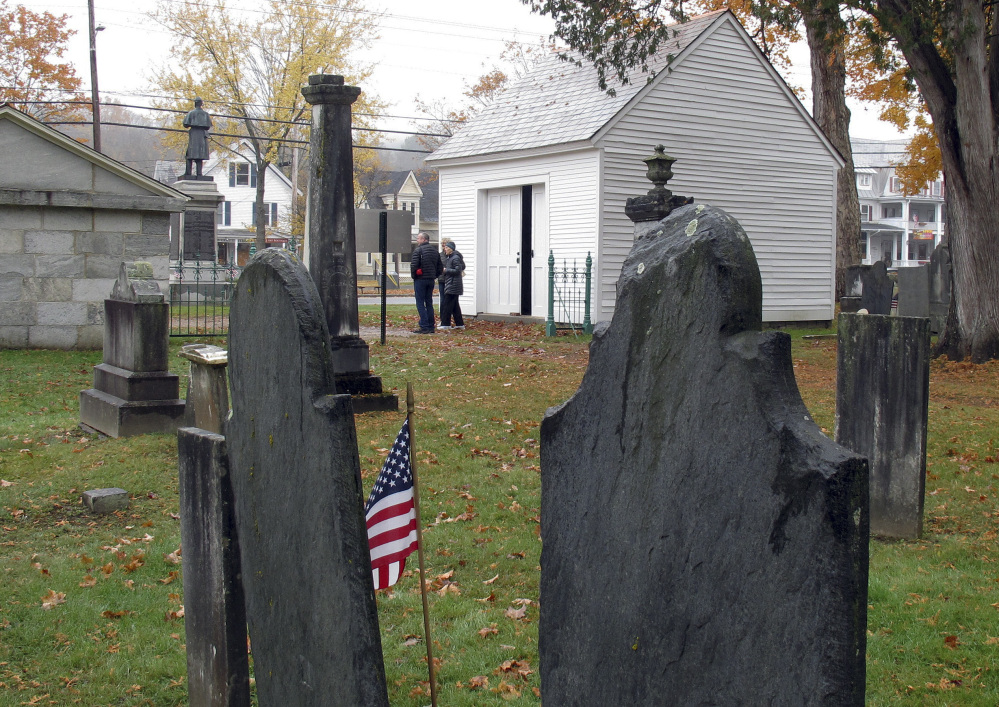 The hearse house, right, and town tomb, left, stand at the entrance to the Brookside Cemetery in Chester, Vt., and remind of a lost tradition both grim and stately.