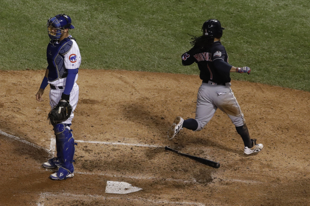 Michael Martinez of the Indians scores past Cubs catcher Willson Contreras in the seventh inning for the only run of Game 3 of the World Series Friday night in Chicago.