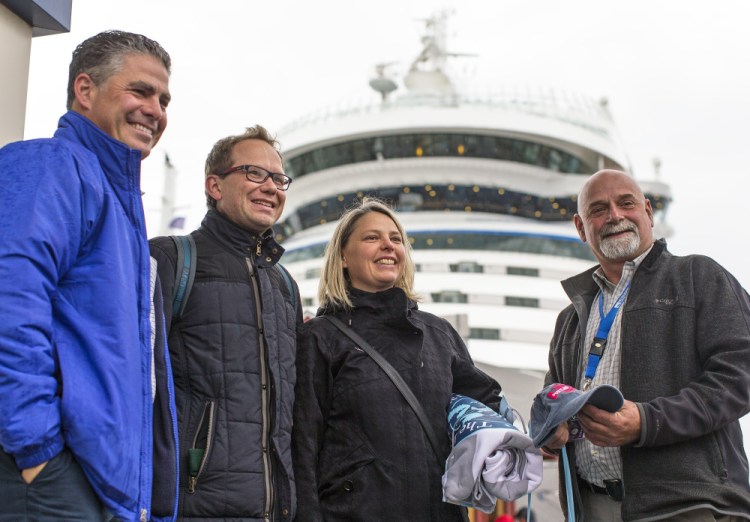 Mayor Ethan Strimling, left, and Cruise Portland's marketing manager Bob Leeman, right, pose with Ralf Staudenmaier and Elke Mayer of Göppingen, Germany. Ben McCanna/Staff Photographer