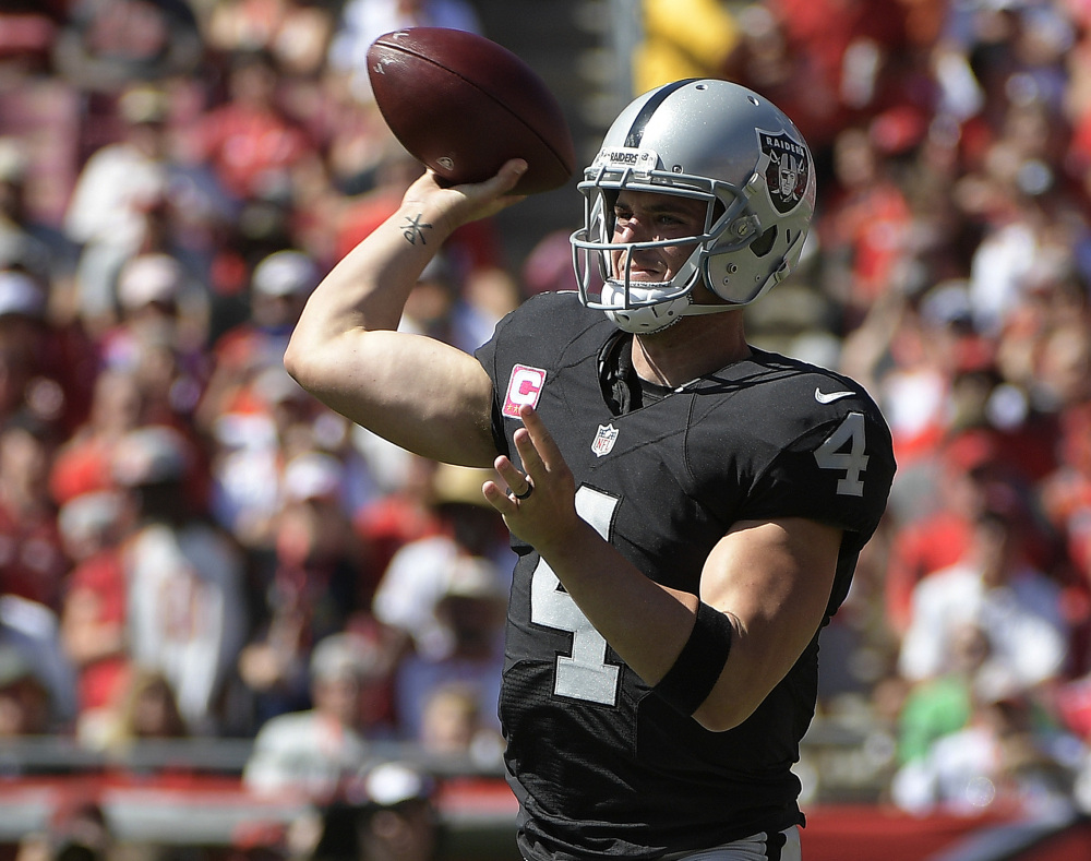Raiders quarterback Derek Carr capped a 513-yard four touchdown performance Sunday with a 41-yard touchdown pass to Seth Roberts in overtime.
