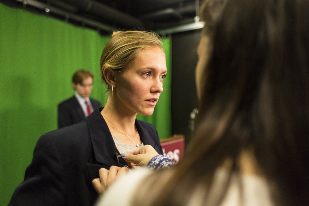 Molly Chisholm, playing a Republican candidate, prepares to make her TV address. As students take the rhetoric class, they also monitor the real presidential campaign.