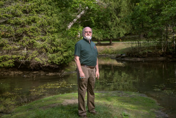 Tom Gordon, Soil and Water Conservation Program Coordinator at Maine Department of Agriculture, Conservation and Forestry, stands by a pond at Evergreen Cemetery in Portland. 
Derek Davis/Staff Photographer