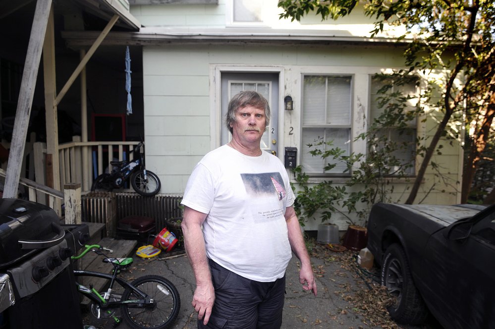 James Pinkham stands outside his apartment at 9 Waldo St. in Augusta in September.
