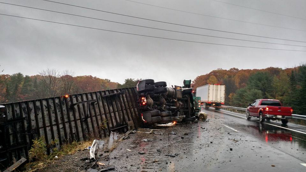 A tractor-trailer truck carrying U.S. mail rolled over Friday morning on Interstate 95 north, near mile 114 in Augusta, backing up highway traffic.