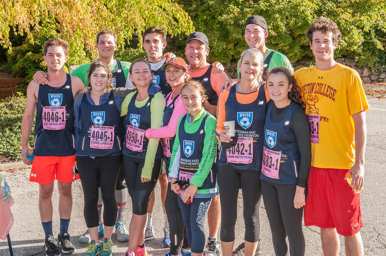 Two of John and Josephine Marrs' children, Bill Marr and Abby Psyhogeos, and four grandchildren – Matthew, Anna and Charlie Marr and Mary Psyhogeos – pose with friends after running in last year's Maine Marathon to raise money for the Alzeimer's fund launched last year by John and Josephine Marr of Falmouth.
Photo by Bob Cunningham