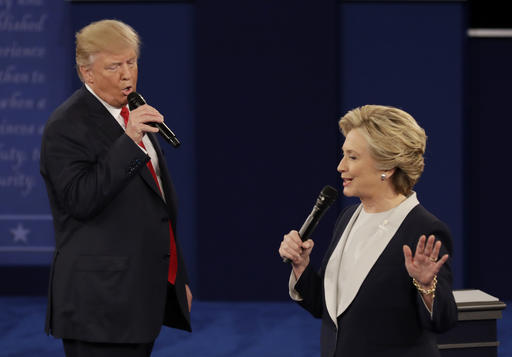 Donald Trump and Hillary Clinton speak during the second presidential debate at Washington University in St. Louis on Sunday. (AP Photo/Patrick Semansky)