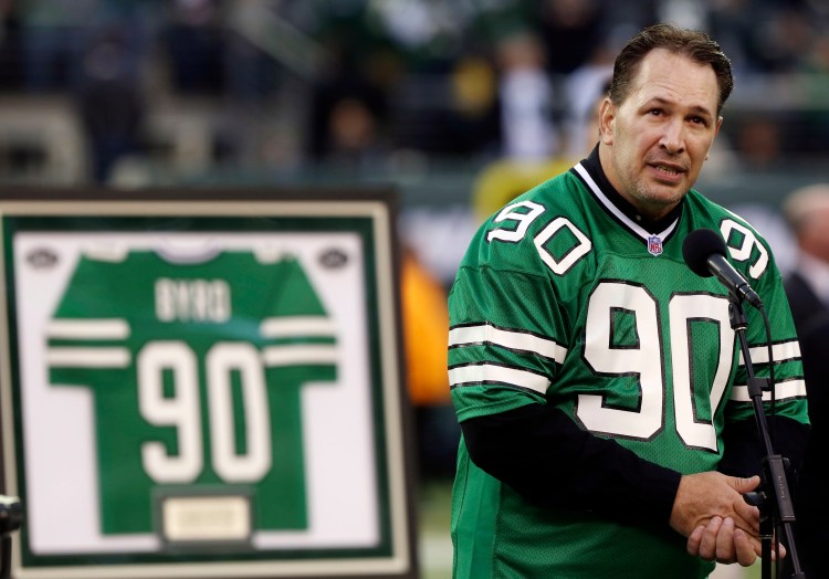 Dennis Byrd speaks at a ceremony to retire his number during the second half of a game between the New York Jets and the Miami Dolphins in October 2012. 
Associated Press/John Minchillo