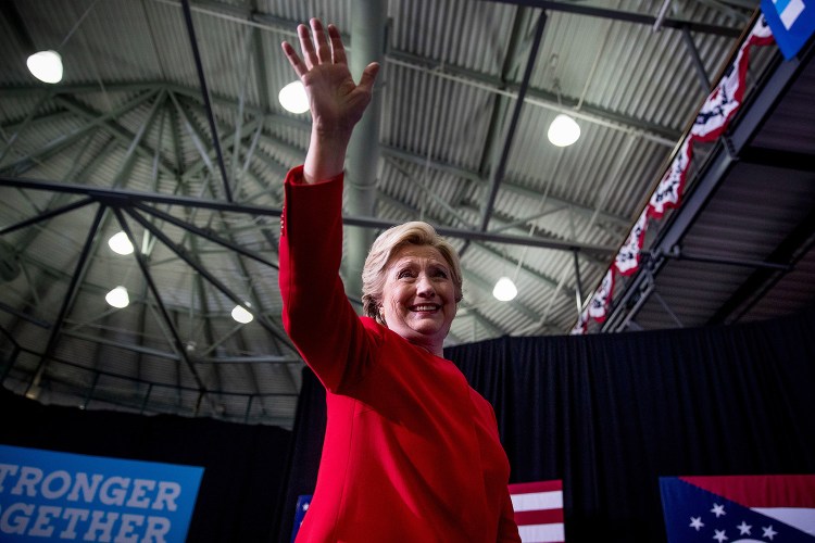 Hillary Clinton waves to the audience Monday as she leaves a rally at Kent State University in Ohio, where she said of the FBI's review of her emails: "There's no case here."
Associated Press/Andrew Harnik