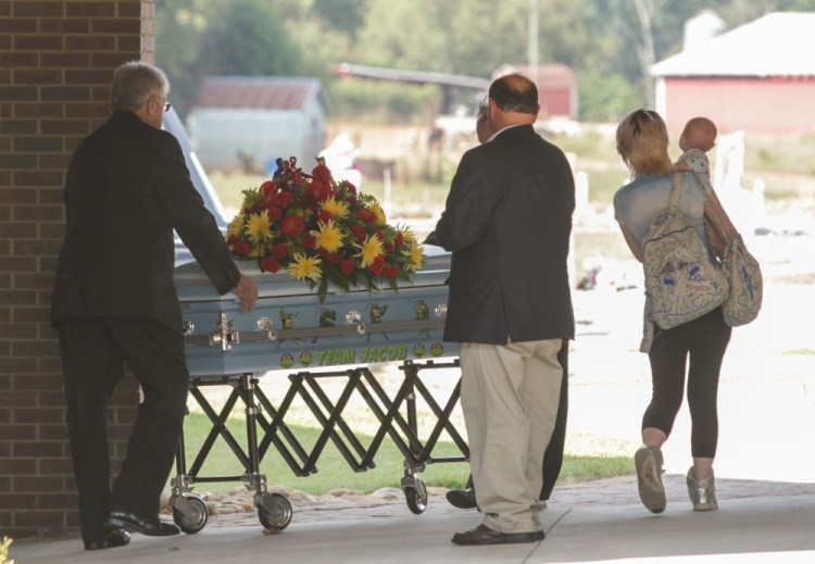 The casket of Jacob Hall arrives for a wake service at Oakdale Baptist Church in Townville, S.C., on Wednesday. 