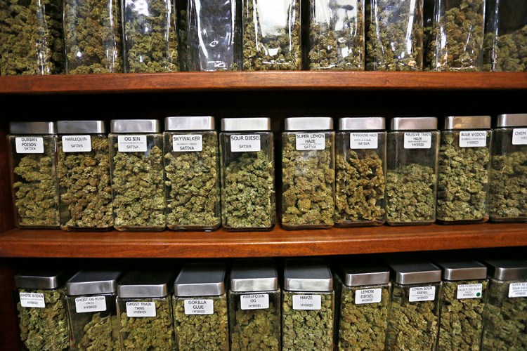 Containers display varieties of marijuana for sale at The Station, a retail and medical cannabis dispensary in Boulder, Colorado. 
