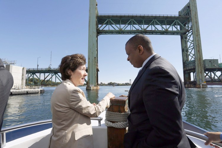 U.S. Sen. Susan Collins talks with U.S. Secretary of Transportation Anthony Foxx during a boat tour of the Route 1A bridge construction site on the Piscataqua River between Portsmouth, N.H., and Kittery on Monday.