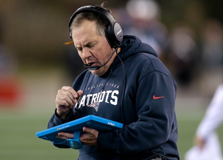 New England Patriots Coach Bill Belichick studies a tablet device along the sideline. He has ranted about the use of technology during games several times.   Associated Press/Charles Krupa