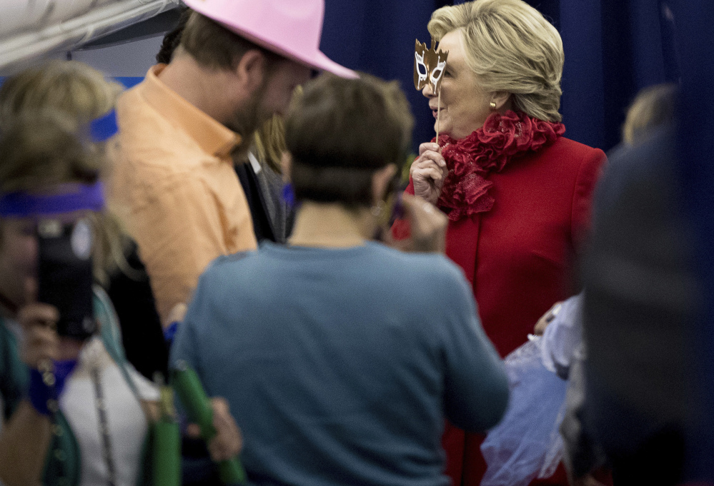 Democratic presidential nominee Hillary Clinton, holding a mask to her face aboard her plane at Cincinnati/Northern Kentucky International Airport Monday, defended herself against the FBI's renewed interest in her emails, saying, "There is no case here."