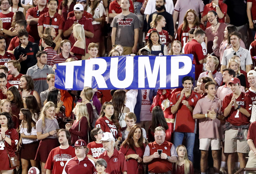 Donald Trump, whose celebrity is important to his businesses, tries to protect his name by buying Web domains that could be used to insult him, such as trumpmustgo.com. But these Oklahoma football fans are on his side.