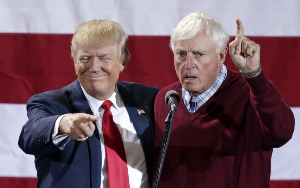 Former basketball coach Bobby Knight appears with Donald Trump during a campaign rally in Grand Rapids, Mich., on Monday.