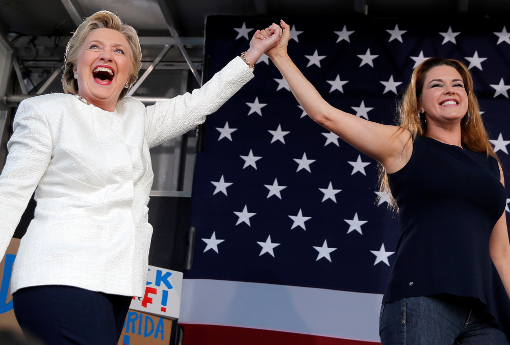 Hillary Clinton takes the stage with former Miss Universe Alicia Machado at a campaign rally at Pasco-Hernando State College in Florida on Tuesday.
