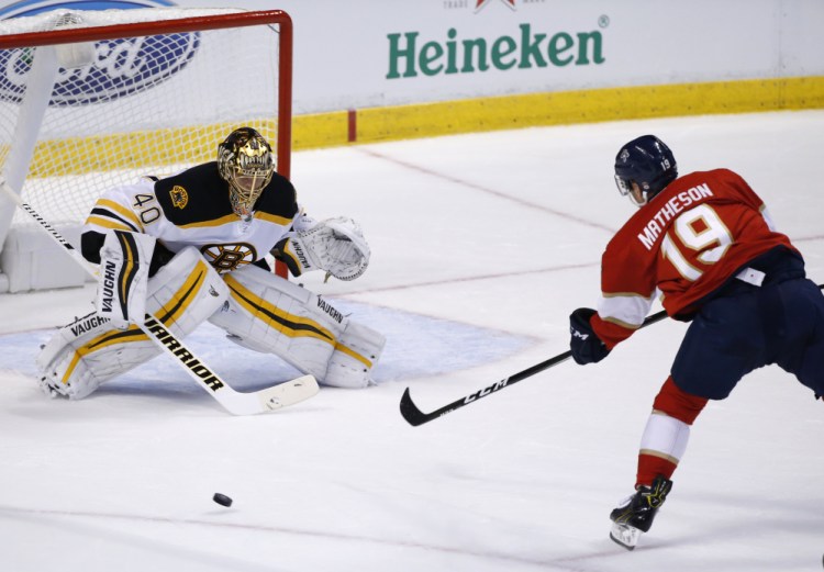 Bruins left wing Brad Marchand puts the puck past Florida goalie Roberto Luongo on a penalty shot in the first period, giving Boston a 1-0 lead.