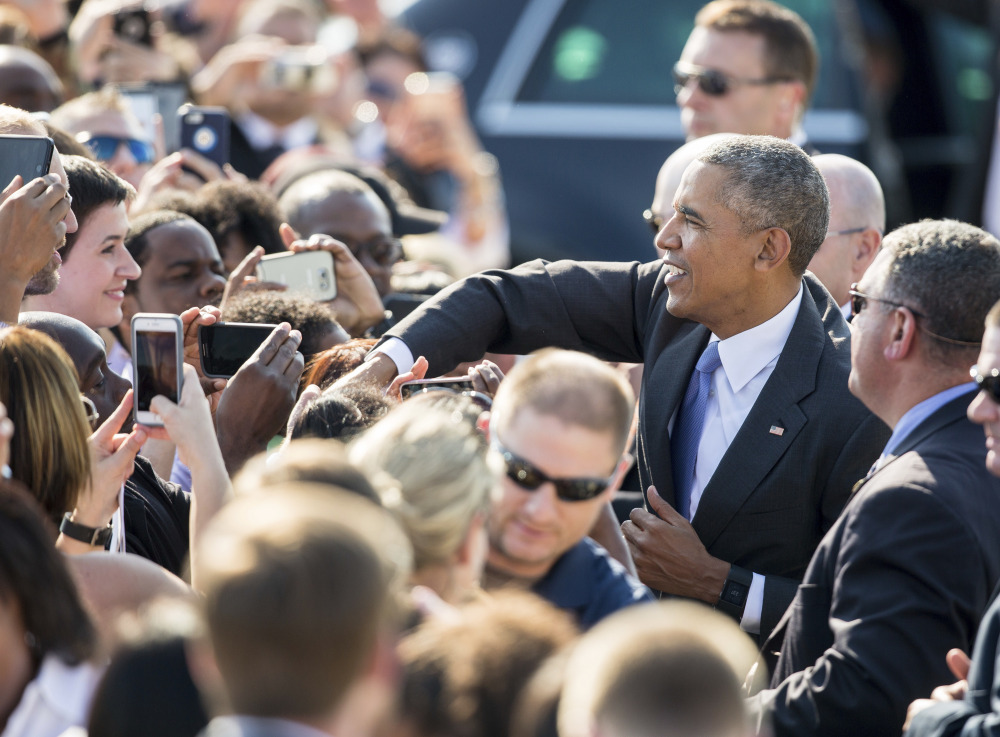 President Obama greets fans on the tarmac after arriving in Morrisville, N.C.,  on Wednesday.