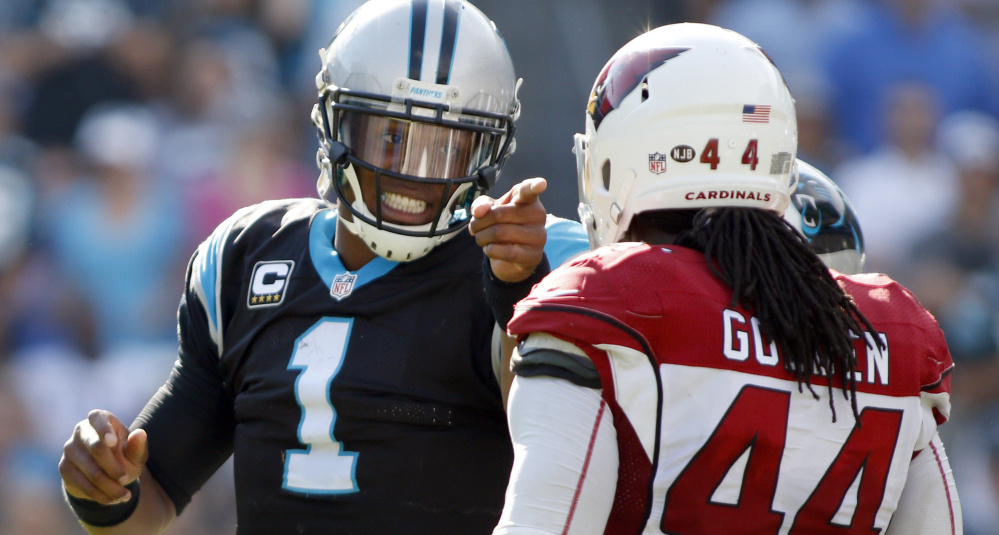 Carolina quarterback Cam Newton, who has complained about referees not making calls on hits against him, points at Arizona cornerback Markus Golden after Golden made what Newton felt was a late hit during a 30-20 Panthers' win on Sunday.