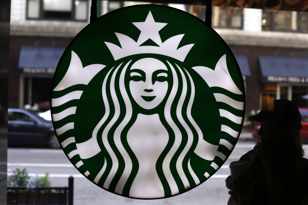 The Starbucks logo appears at one of the company's coffee shops in downtown Chicago. Starbucks reported financial results Thursday.