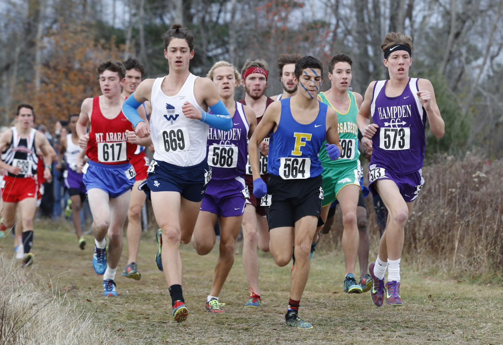 Runners are closely packed during the Class A boys' state championship race Saturday in Belfast.