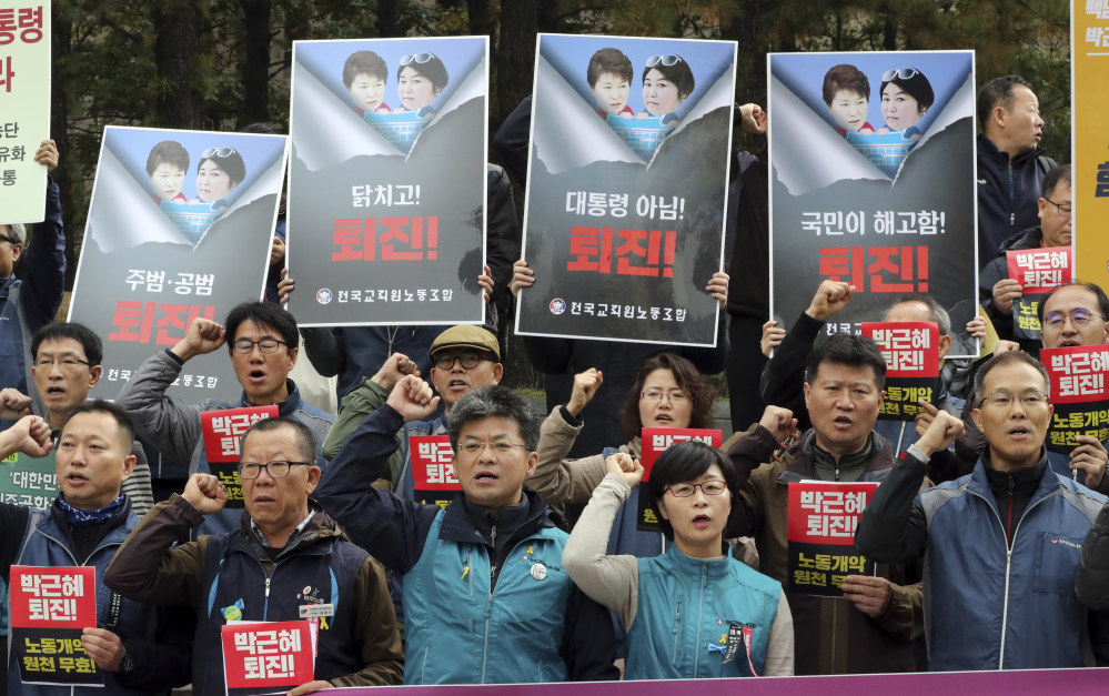 South Korean union members shout slogans during a rally calling for South Korean President Park Geun-hye to step down in downtown Seoul on Friday.