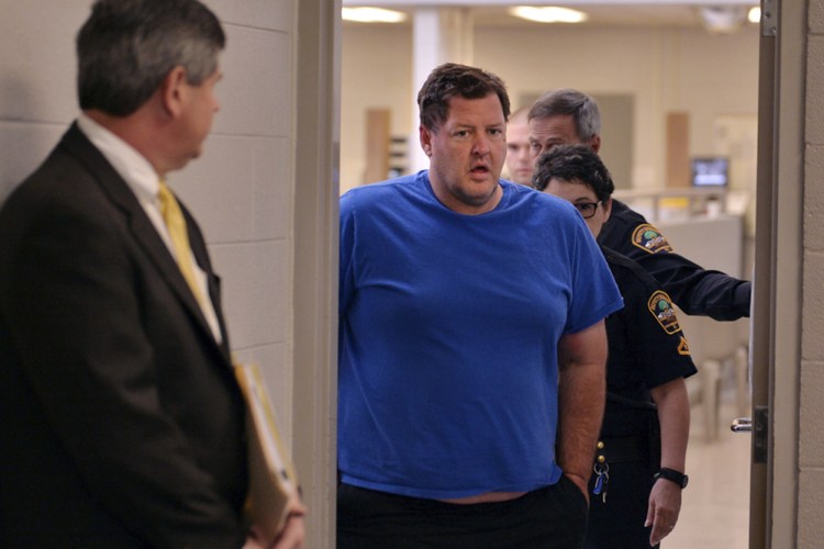 Todd Christopher Kohlhepp is escorted into a courtroom on Friday. 