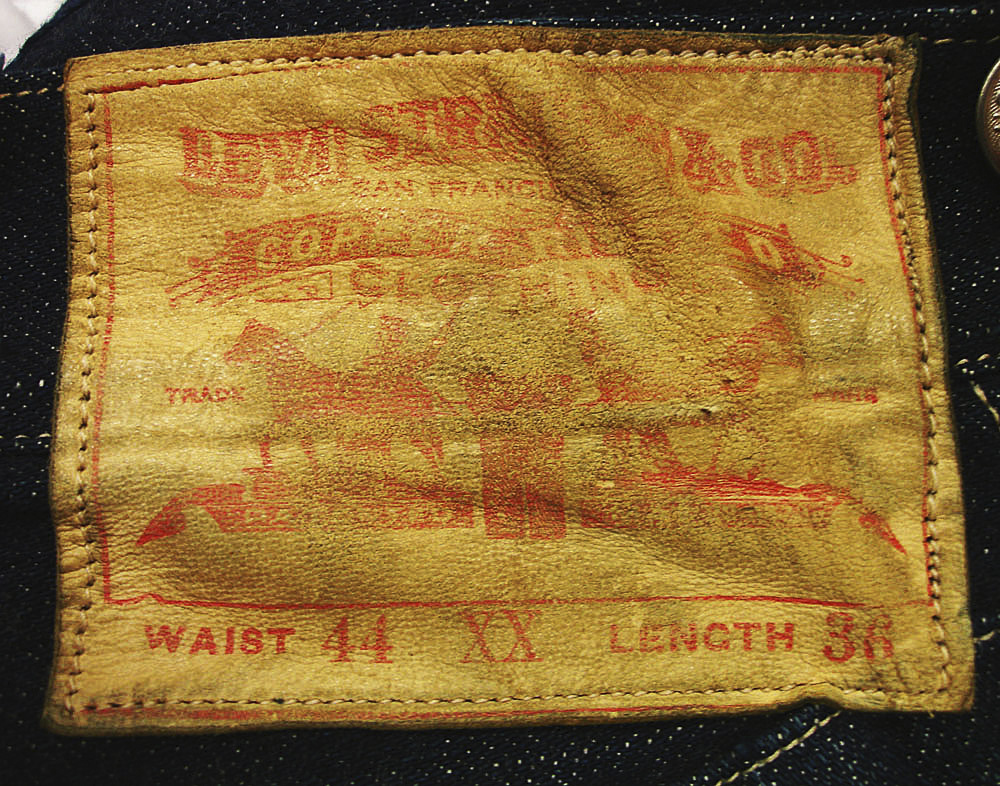A leather label adorns a pair of 1893 Levi-Strauss denim blue jeans.