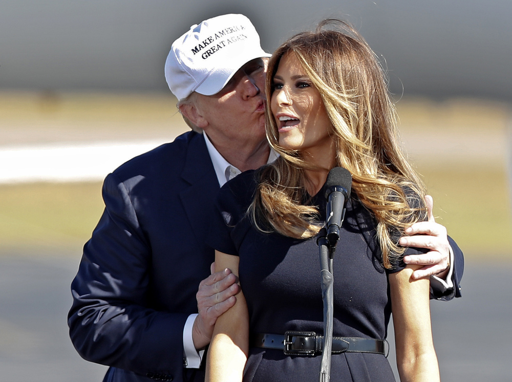 Donald Trump kisses his wife, Melania, as she introduces him at a campaign rally, in Wilmington, N.C. – one of several Democratic-leaning bastions he visited Saturday, with more to come.