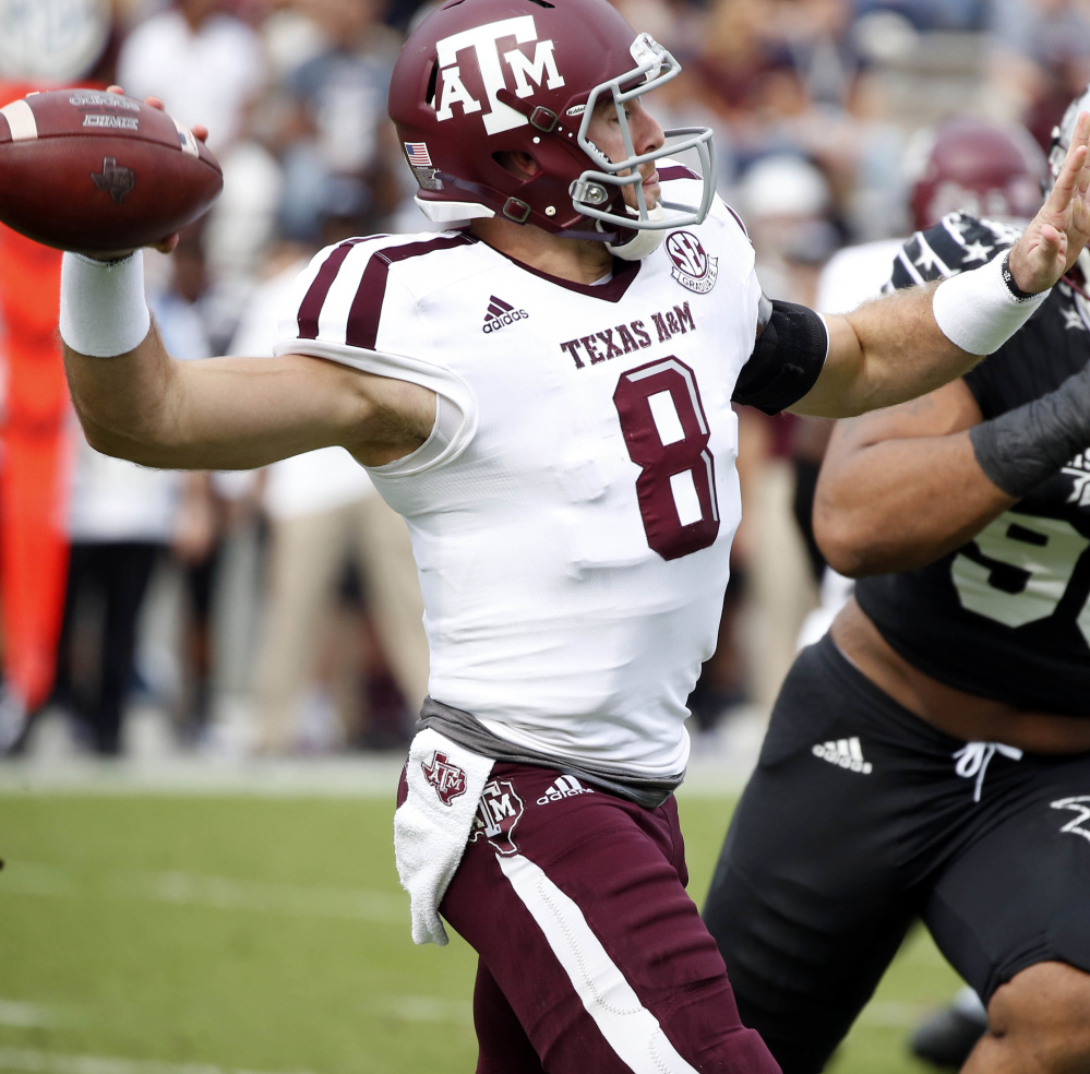 Texas A&M quarterback Trevor Knight (8) is pressured by Mississippi State defensive lineman Jeffery Simmons (98) as he passes in the first half of an NCAA college football game in Starkville, Miss., Saturday, Nov. 5, 2016. (AP Photo/Rogelio V. Solis)
