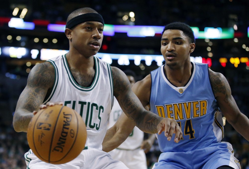 Denver's Gary Harris, right, defends against Boston's Isaiah Thomas during the first quarter of the Nuggets' 123-107 victory in Boston on Sunday.