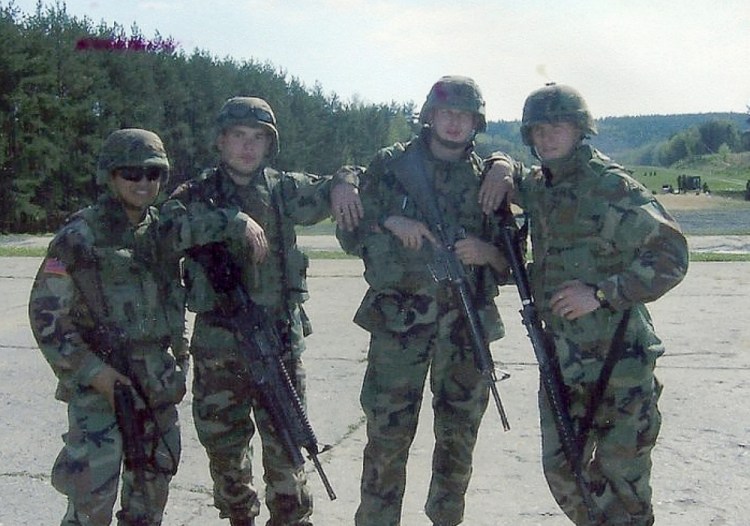 Bryan Noyes, left, with his forward observer team in the field in Germany.