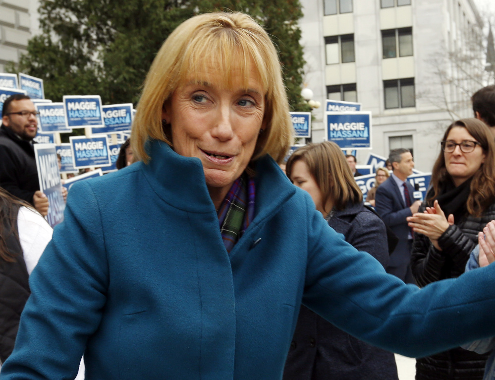 New Hampshire's newly elected Democratic senator, Gov. Maggie Hassan, left, speaks with supporters at the Statehouse in Concord on Wednesday. Her race with incumbent Republican Sen. Kelly Ayotte, right, was one of the nation's most closely watched.