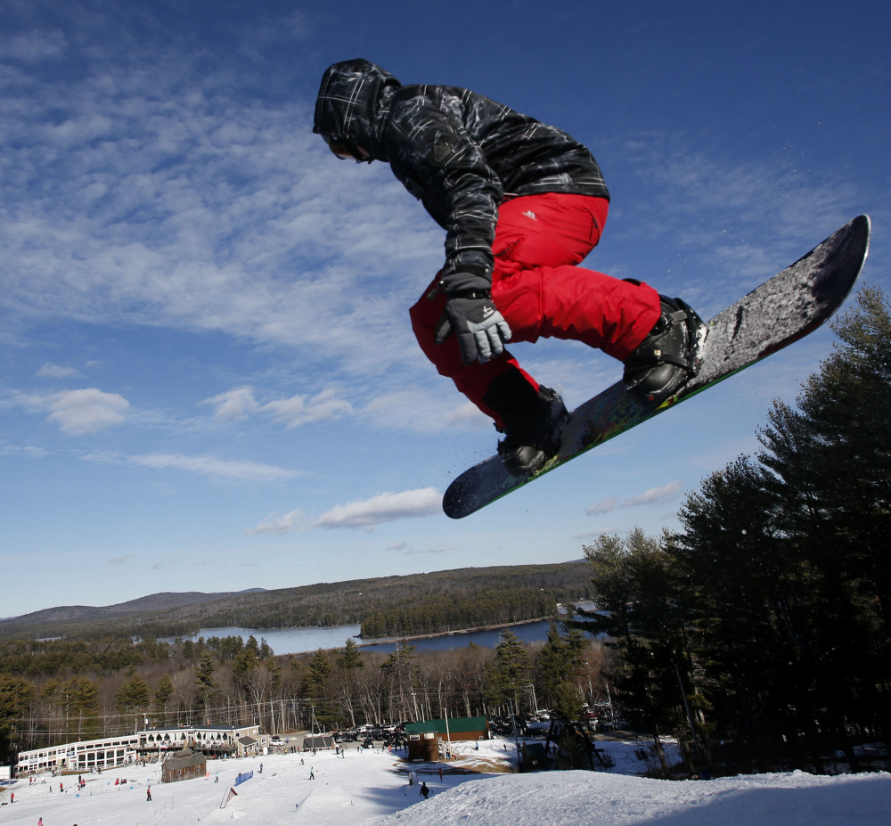 A snowboarder catches some air at Shawnee Peak. The Bridgton ski area has made upgrades to its base station and a major renovation of its rental shop.