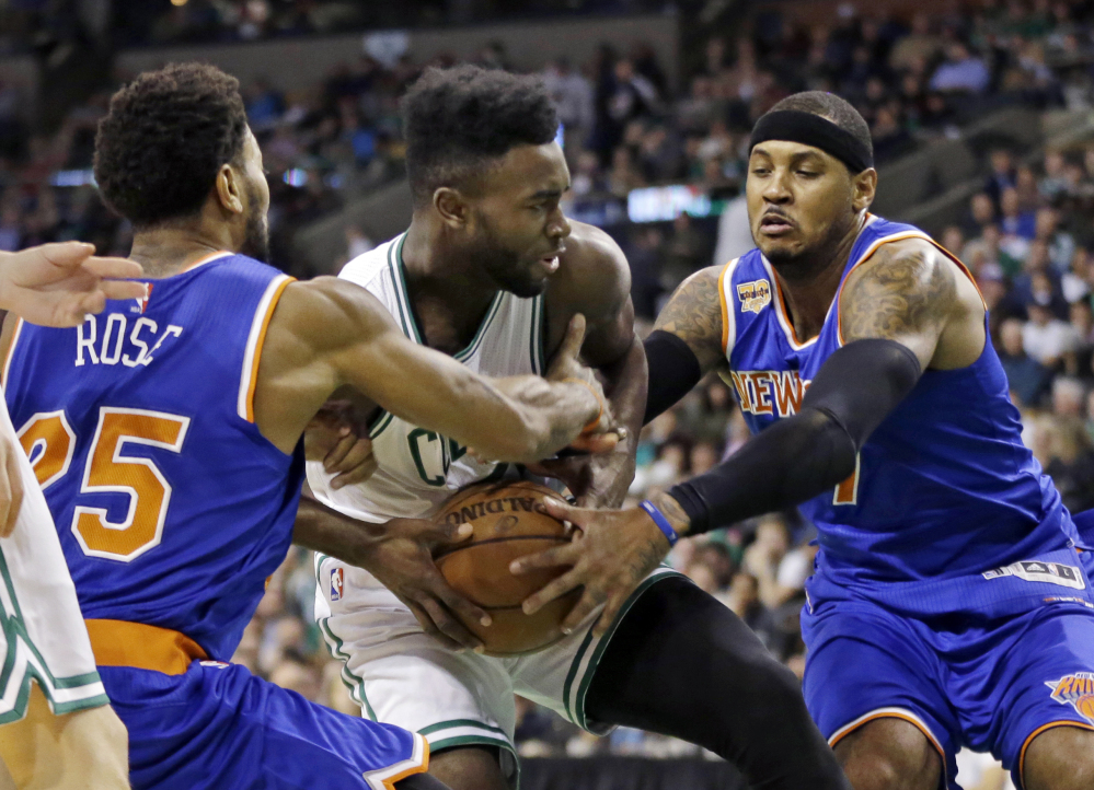 New York's Derrick Rose, 25, and Carmelo Anthony try to tie up the ball controlled by Boston's Jaylen Brown in the first quarter Friday night in Boston.