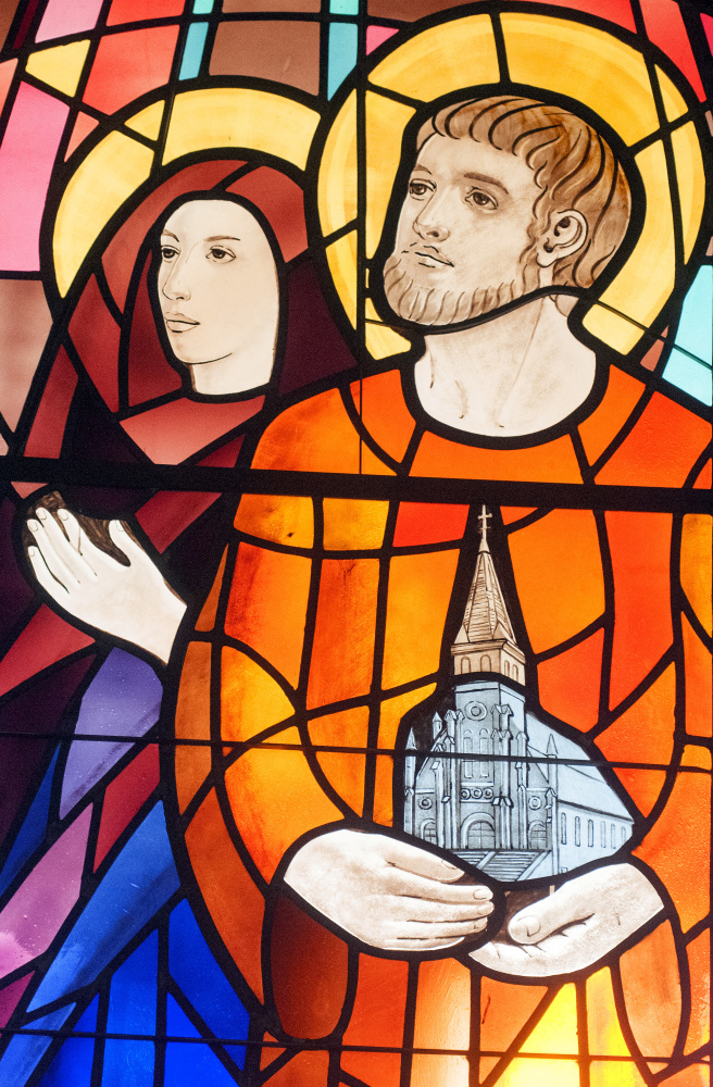 This image, showing part of a large stained glass window behind the choir loft, was taken on Friday at St. Augustine Church in Augusta. It shows Saints Monica, left, and Augustine, who is holding a model of the church building.