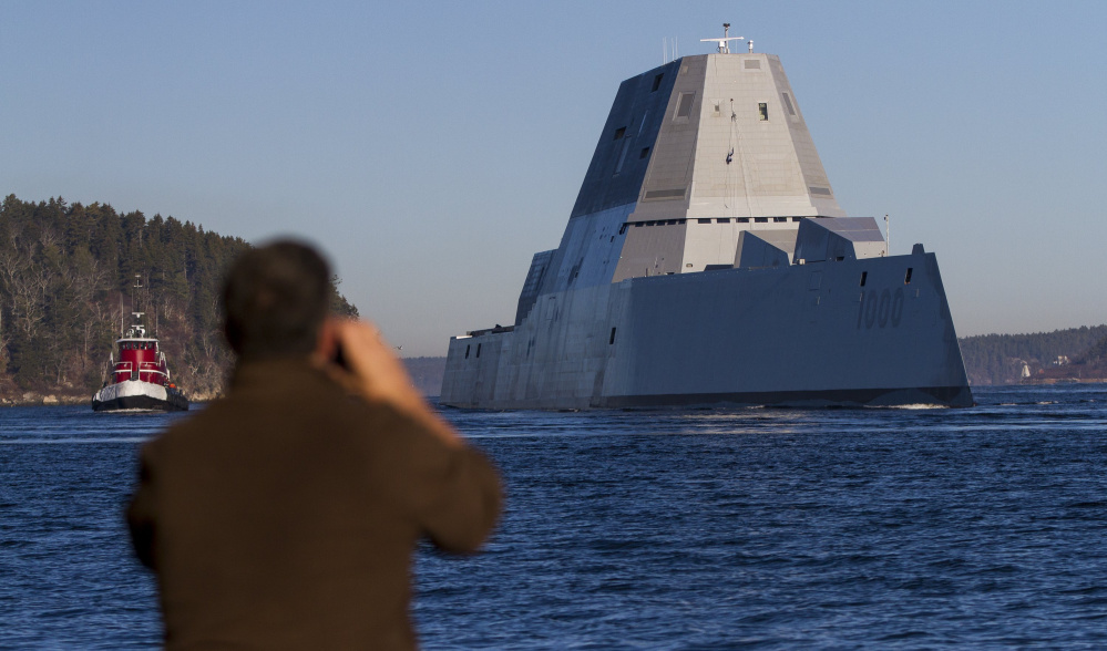 The Navy's newest destroyer, the Zumwalt, sails down the Kennebec River toward the Atlantic for a series of sea trials after leaving Bath Iron Works, where it was built.